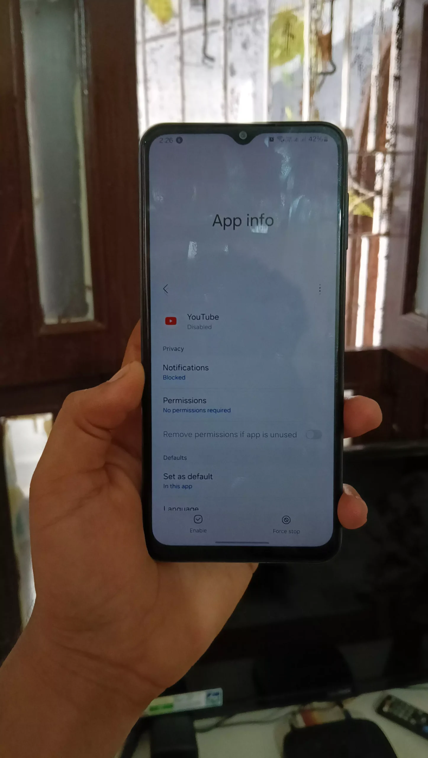 image of android holding the app info youtube app info and it is disabled